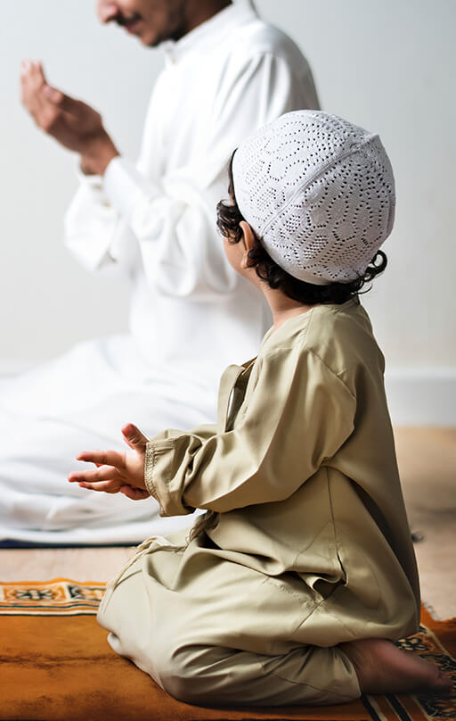 Little boy praying on his knees